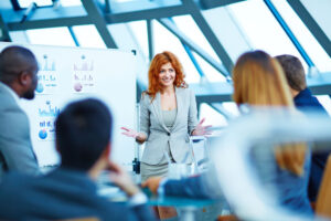 business people listening to presentation at corporate event