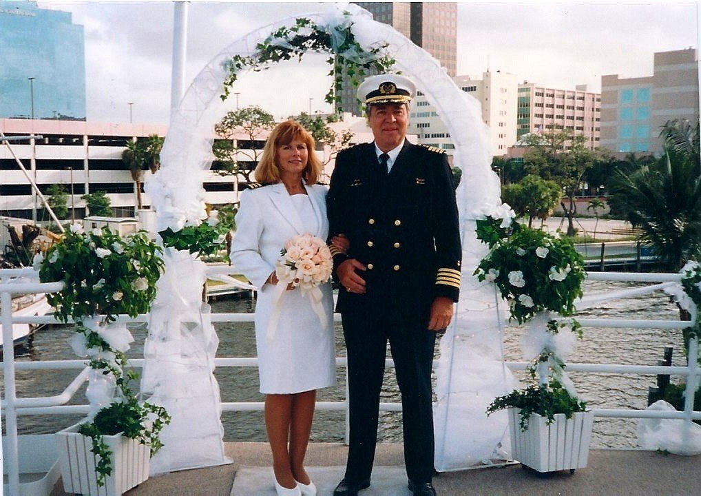 A Man and Woman in Military Uniforms Stand Together on a Bridge, Showcasing Camaraderie and Service.